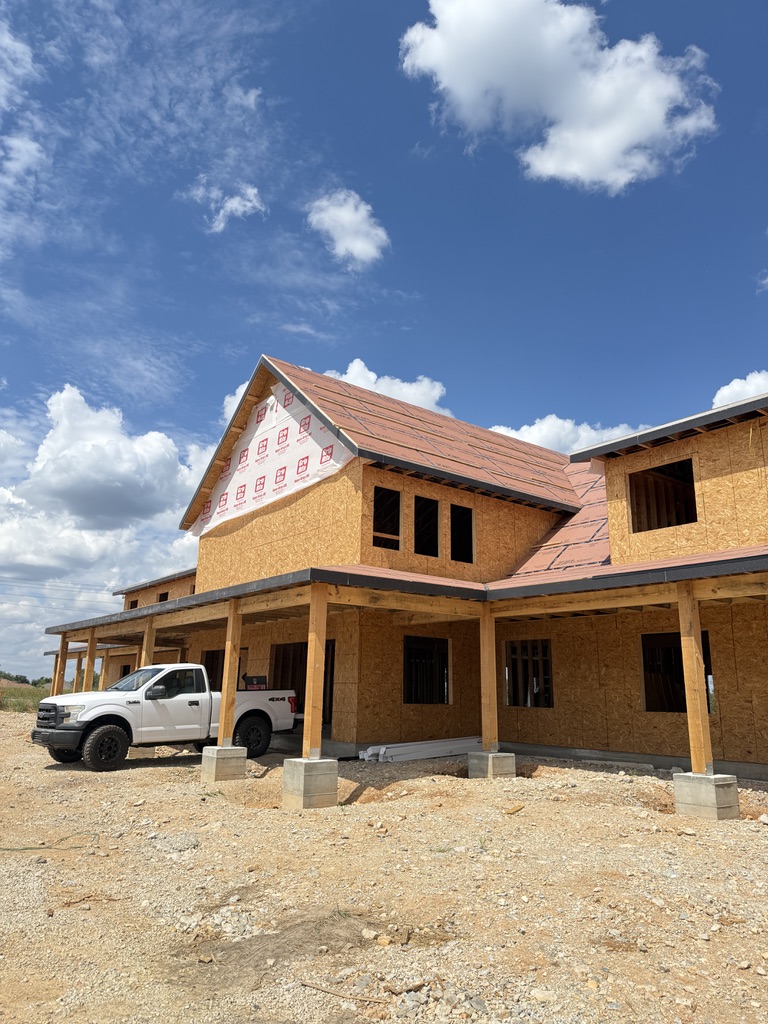 Custom home exterior under construction — pre-wire and structured cabling install in progress