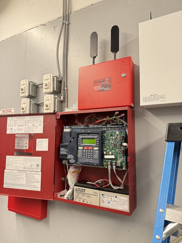 NAPCO StarLink fire alarm panel installed and being commissioned