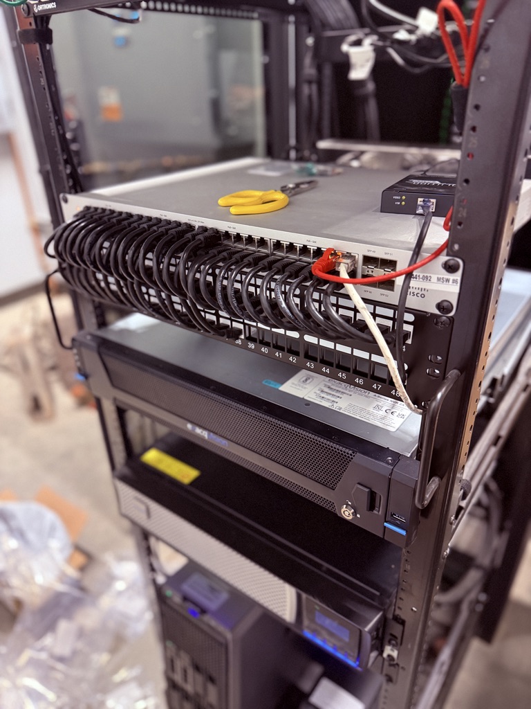 Network rack with Cisco managed switch and Ortronics patch panel, Cat6 cables looped cleanly