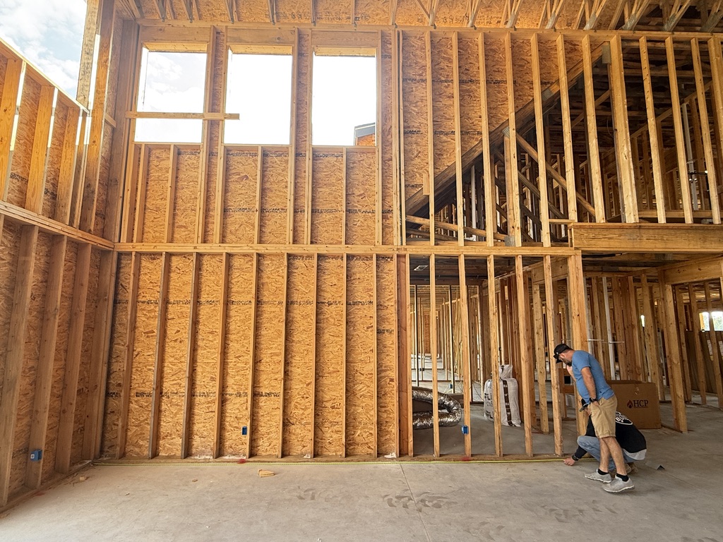 Technician on-site during custom home pre-wire phase