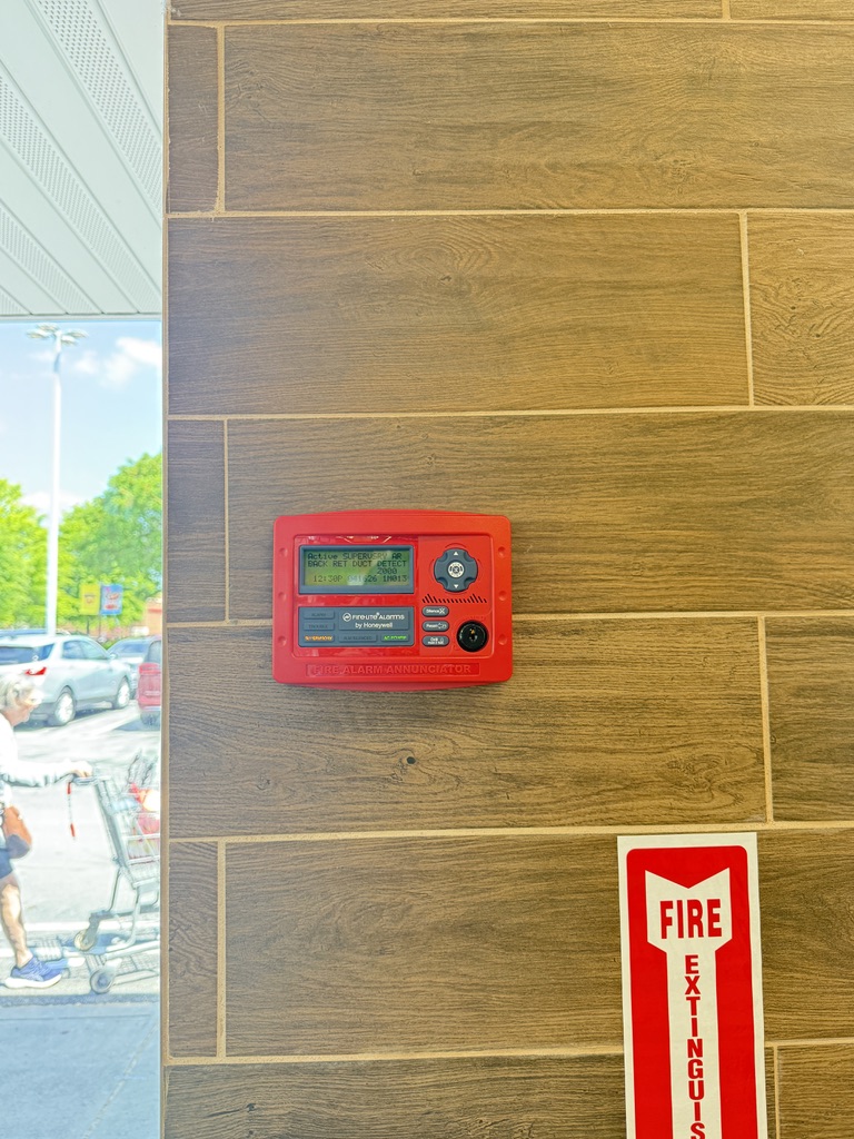 Honeywell fire alarm annunciator panel installed on commercial wall