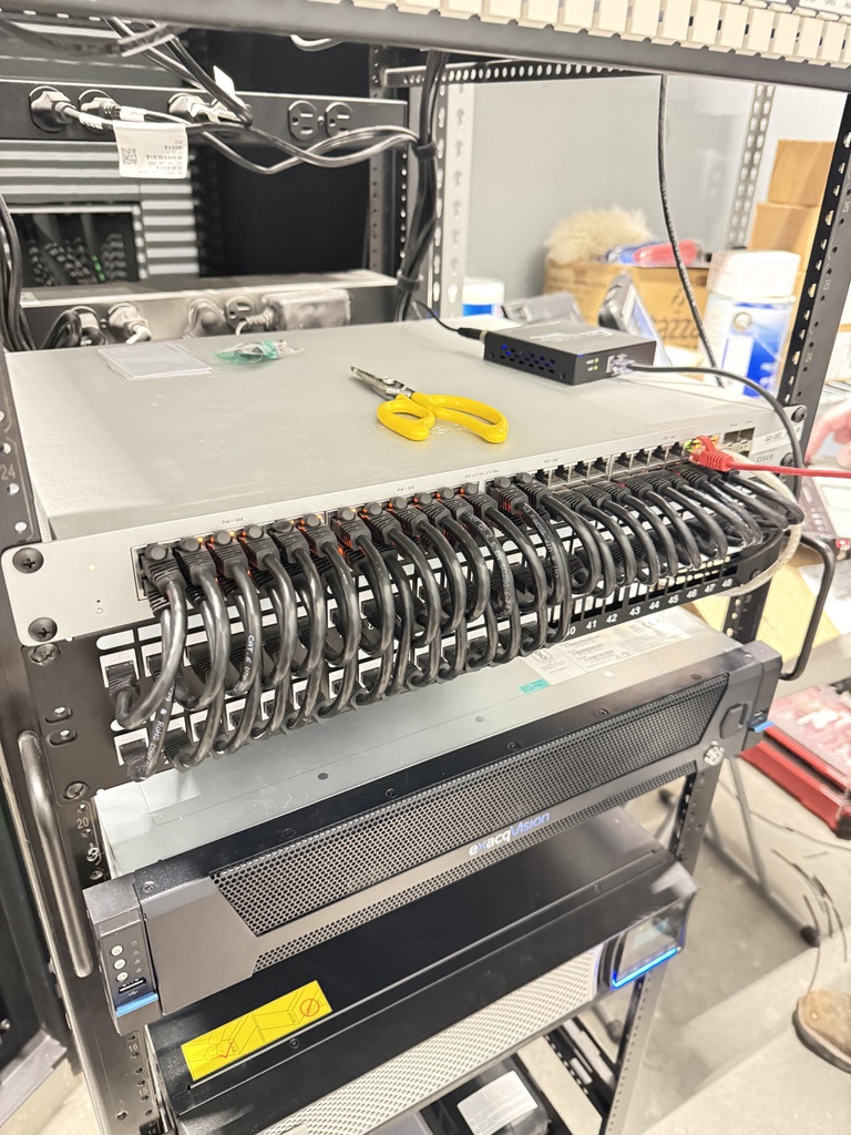 Cleanly cabled network patch panel rack — backbone for whole-home audio and smart-home integration
